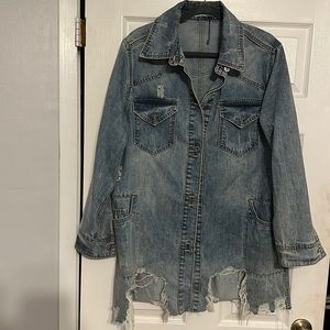 Gorgeous distressed jean jacket. Size Medium. New